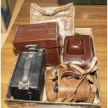 Four vintage cameras and a handbag