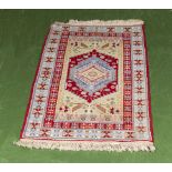 A small Moroccan wool rug 130cm x 80cm