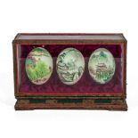 Three decorated eggs with Japanese scenes in velvet lined box