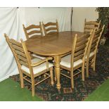 A modern light oak table, four dining chairs and two carvers