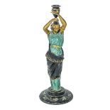 A painted spelter classical figure candle stick 39cm tall