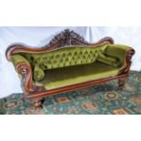 Victorian button back settee with carved mahogany frame