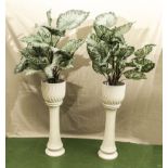 A pair of 20th century white pottery jardinieres and stands