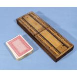 A cribbage box and cards