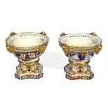 A pair of Derby Imari pot pourri vases' lacking covers, 10cm tall