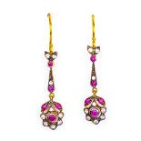 A pair of fine quality reproduction silver gilt earrings set with rubies and amethysts