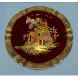 A Carlton ware rouge royale plate