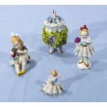 Three small China figures with net dresses and a small pot pourri