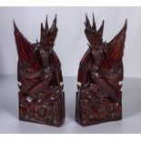 A pair of Indonesian hard wood carved figures. 31cm tall