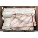 A box of vintage linen cloth and others