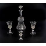A thistle crystal glass decanter and three matching sherry glasses