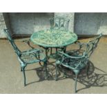 A small metal garden table and three chairs (one other chair in pieces)
