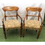 A pair of oak elbow chairs