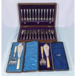 A cased set of fish cutlery and two sets of fish servers