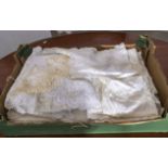 A box containing vintage lace and linen