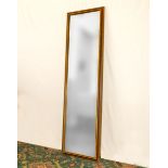 An antique bevelled glass mirror 1.6m tall x 46cm wide