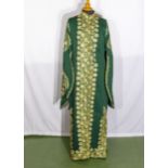 A lady's Arabic kaftan dress in green and gold