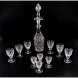 A crystal decanter and ten assorted wine glasses