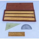 Three vintage wooden rulers in fitted box and three other items