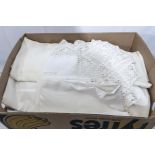 A box containing vintage table linen