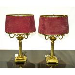 A pair of 20th century brass table lamps and shades