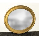 An Edwardian gilt framed oval mirror