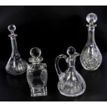 Three crystal decanters and a carafe