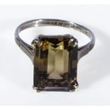 A lady's silver ring set with a topaz
