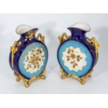 A pair of antique porcelain French vases with gilt handles, 24cm tall