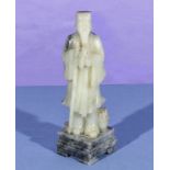 A Chinese white jade figure of a sage, 25cm tall