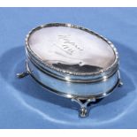 An oval silver lidded box marks for London 1909 makers Charles Edwards