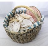 A basket of vintage table linen and lace