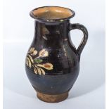 18th century slipware decorated brown glazed jug. 25cm tall