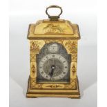 A small brass faced bracket clock with Chinese lacquered panels by Canham of London. Circa 1920s