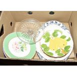 A box of table pottery and a cake stand