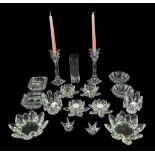 A collection of glass candle holders