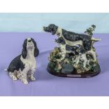 Two spaniel figure groups