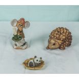A pottery hedgehog money box, mouse and panda