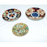 Two Japanese Imari plates and a Famille Rose dish