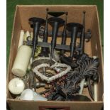 A box of assorted candle holders