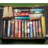 A box of novels, Wilbur Smith, Tom Clancy and Dick Francis