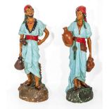 A pair of Austrian pottery figures, unmarked 66cm tall