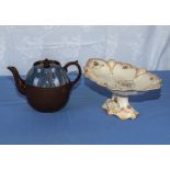 A brown pottery teapot and a comport