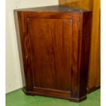 A mahogany corner cabinet