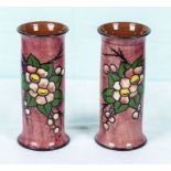 A pair of pink pottery vases
