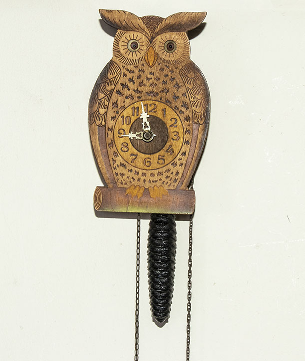 An owl clock in need of restoration
