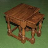 A nest of two oak tables