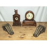 Two reproduction clocks and a pair of wall brackets