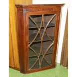 A mahogany glazed corner cabinet