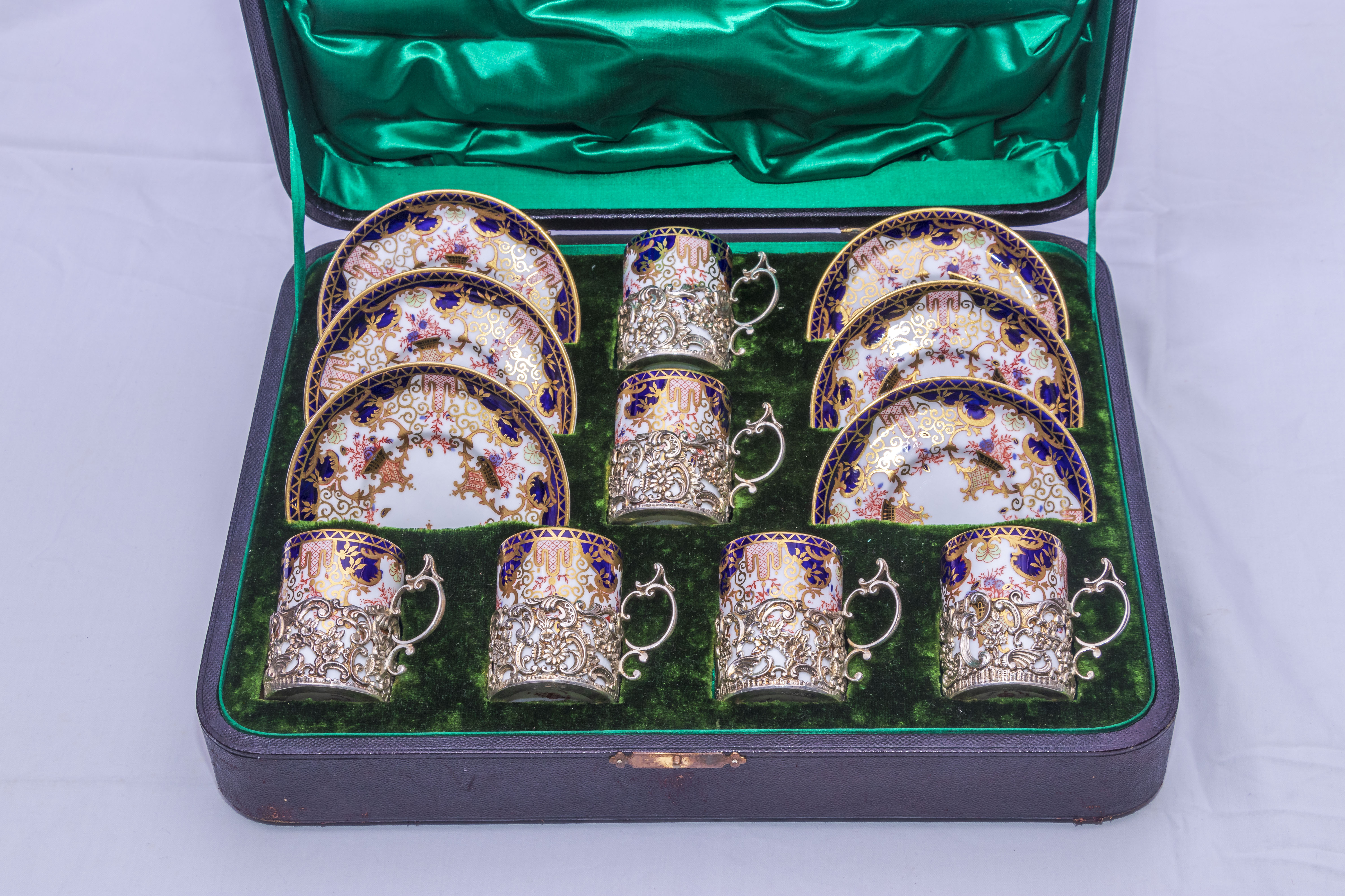 Royal Crown Derby silver mounted coffee cans and saucers in leather case